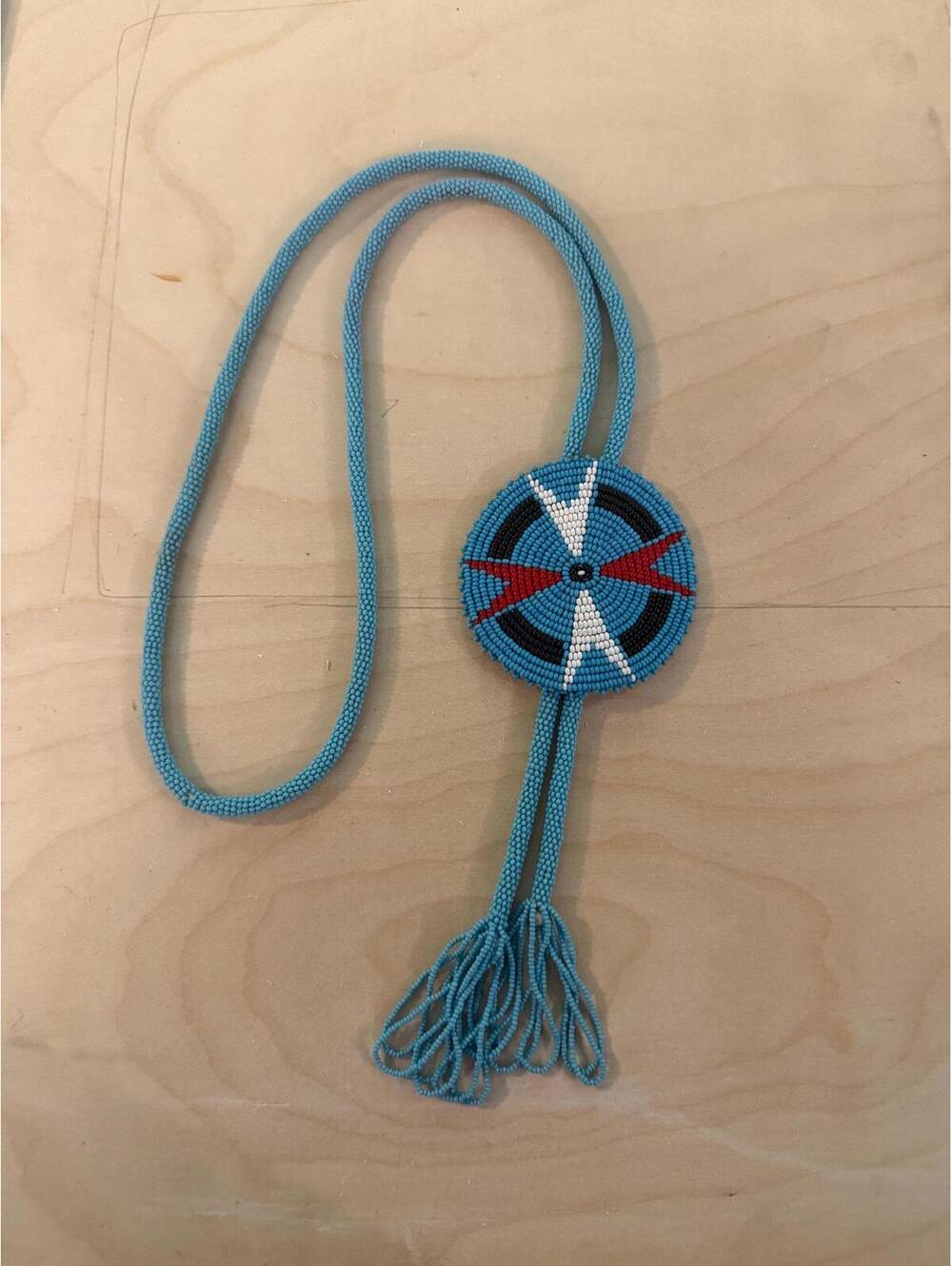 Vintage beaded Native American medallion bolo tie Navajo necklace horse tassel